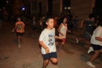 Centenares de niños disfrutan con el encierro de carretones embolados